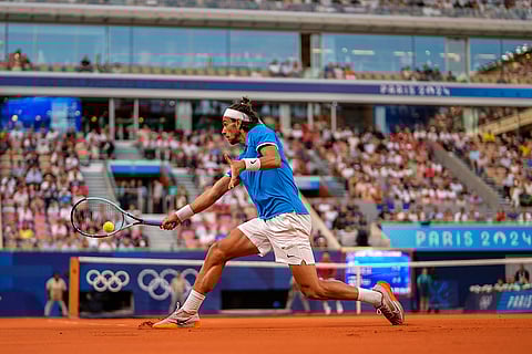 Lorenzo Musetti returns the ball against Novak Djokovic